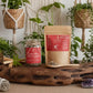 Cylcle Calm and Flow Supplies products on a wooden tray with plants in the background