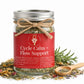 Jar of 'Cycle Calm + Flow Support' herbal mix with a red label on a white background
