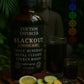 Bottle of 'Eviction Enforcer Blackout' with a Buddha statue and natural elements in the background