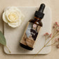 Postpartum healing oil for natural births with flower