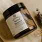 Jar of 'Sacred Renewal' cream with a label on a beige background
